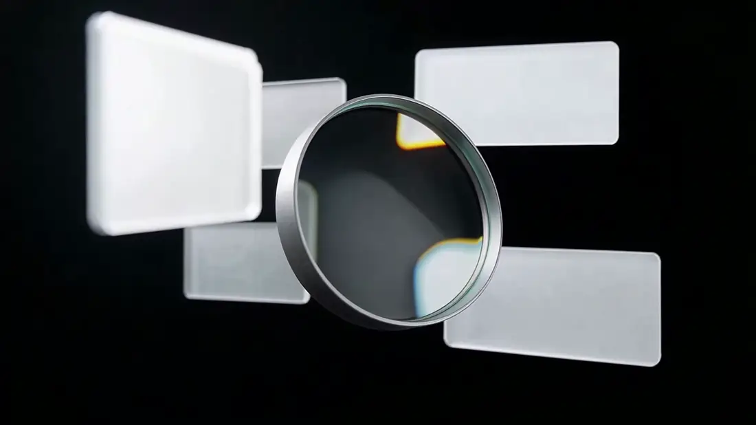 A magnifying lens moving across blank floating cards, bringing one forward